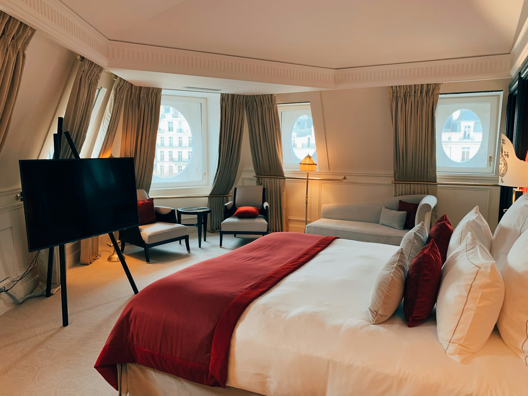 A classic bedroom with tall windows