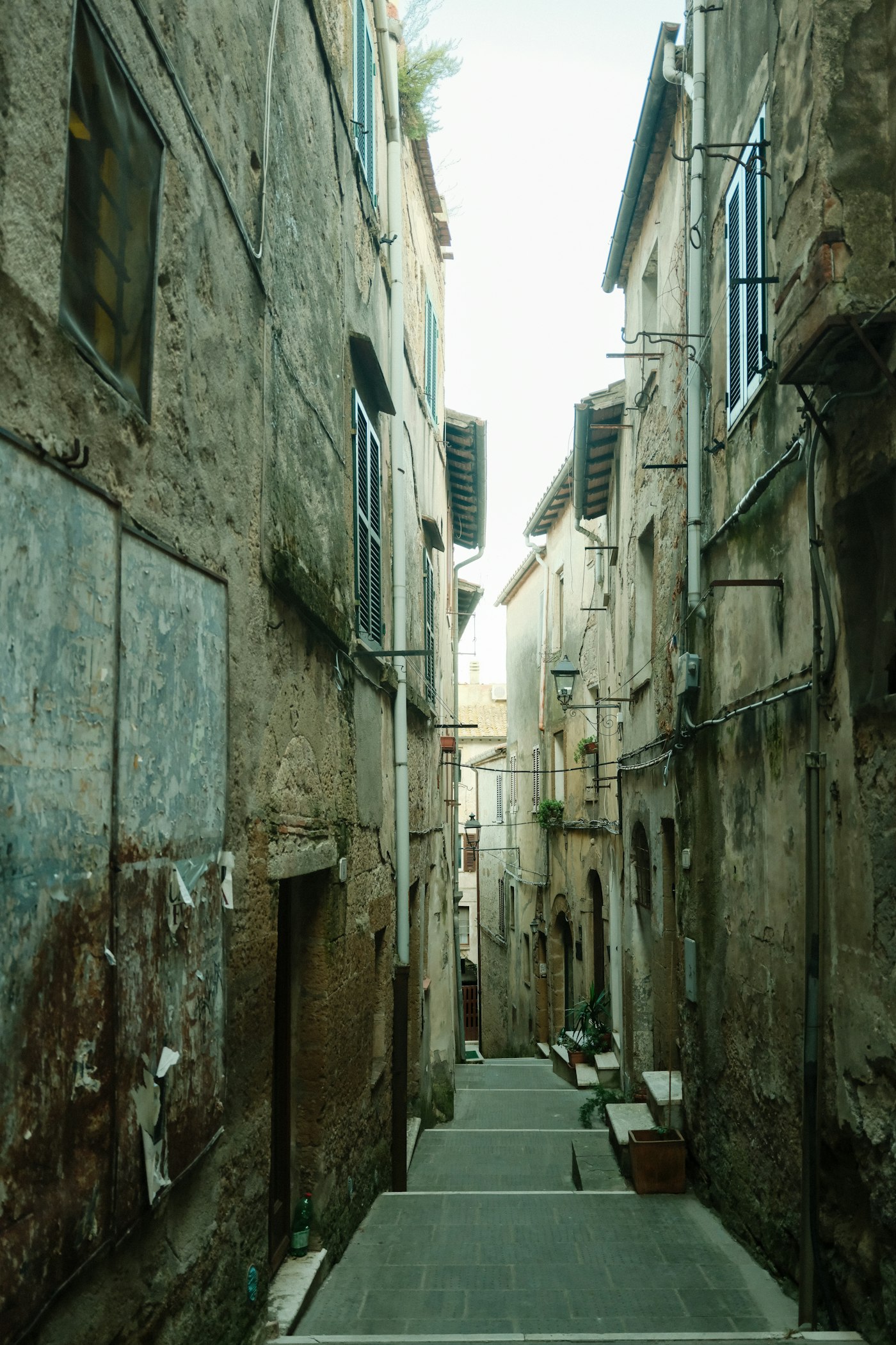A narrow cobbled lane between old stone houses