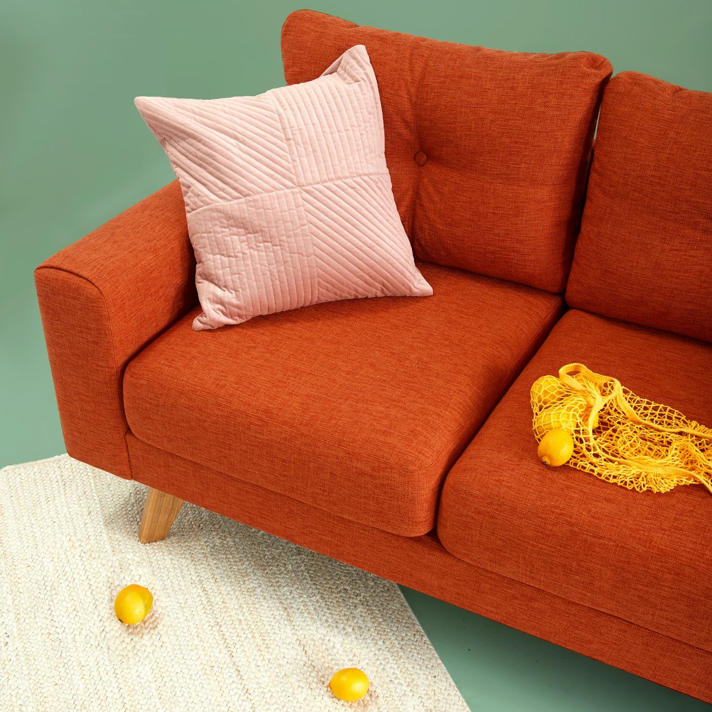 A mustard lounge chair beside a side table