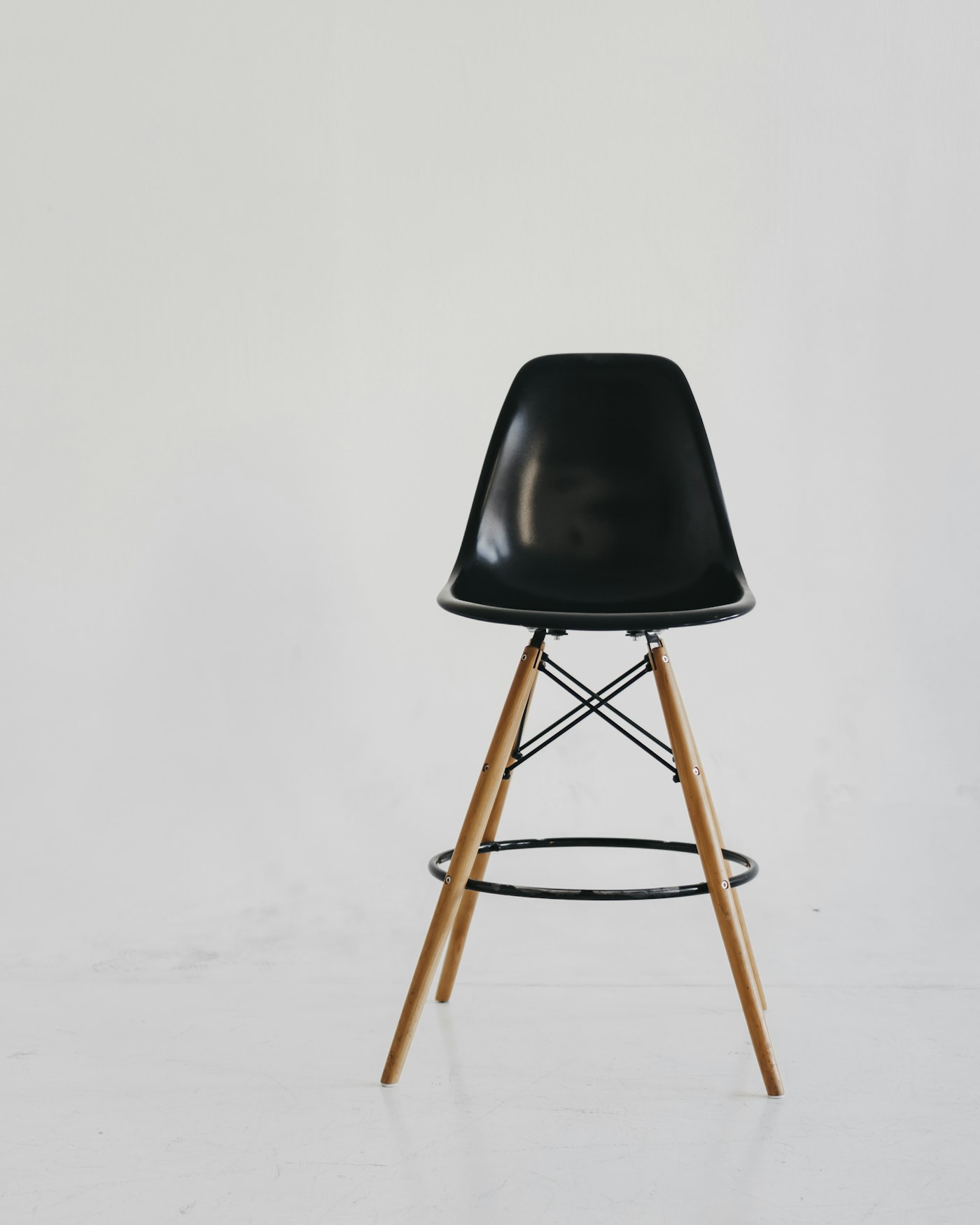 A mustard lounge chair beside a side table