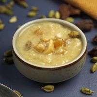 Payasam with cashews and raisins in a ceramic bowl