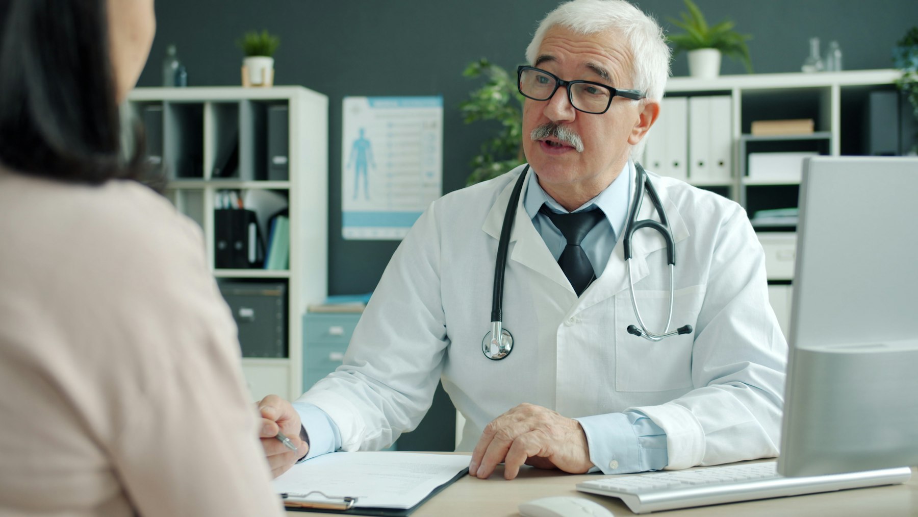 A doctor at her desk
