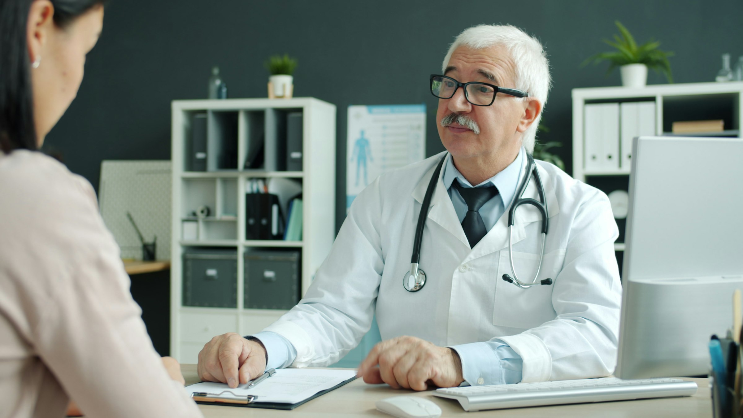 A doctor at her desk